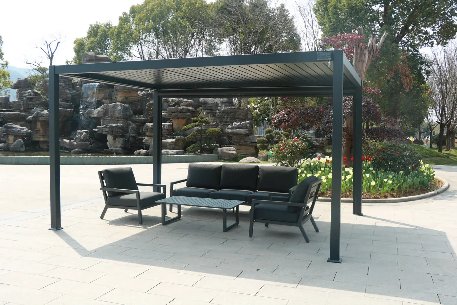 Angled view of freestanding pergola and outdoor seating